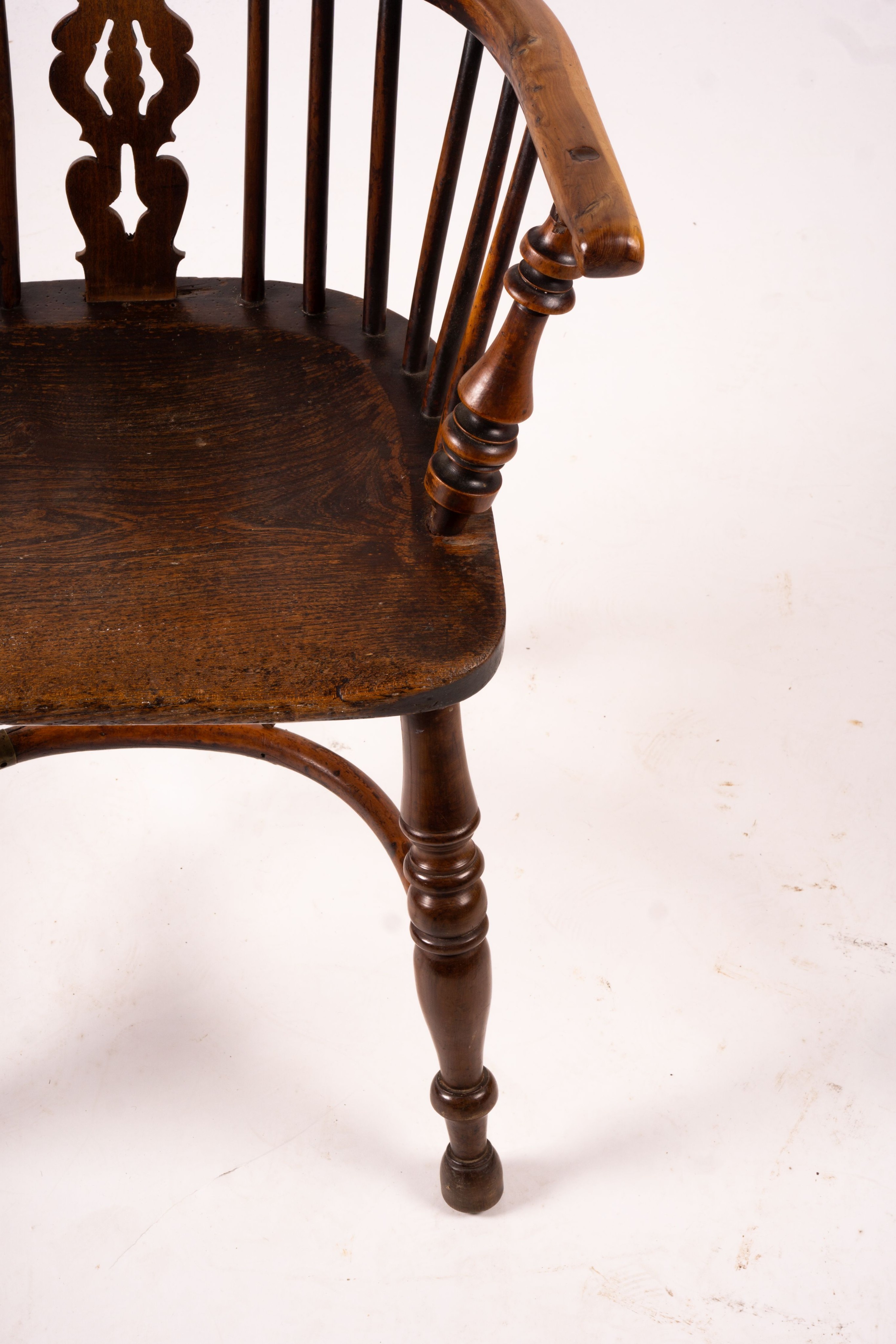 A 19th century yew and elm Yorkshire area Windsor elbow chair with crinoline stretcher, width 60cm, depth 45cm, height 93cm